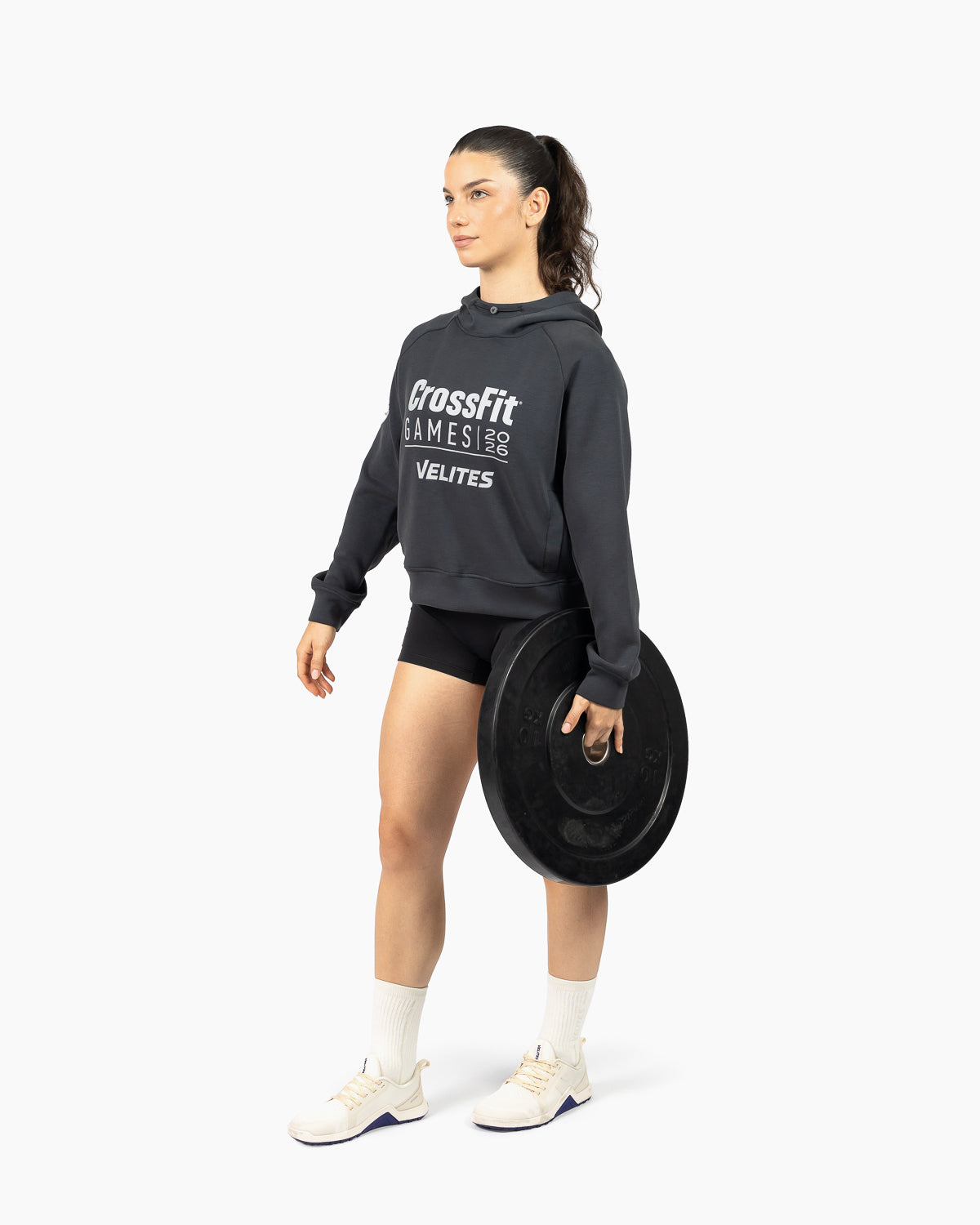 Athlete in gym wearing the official crop hoodie from the 20th Anniversary CrossFit Games capsule collection