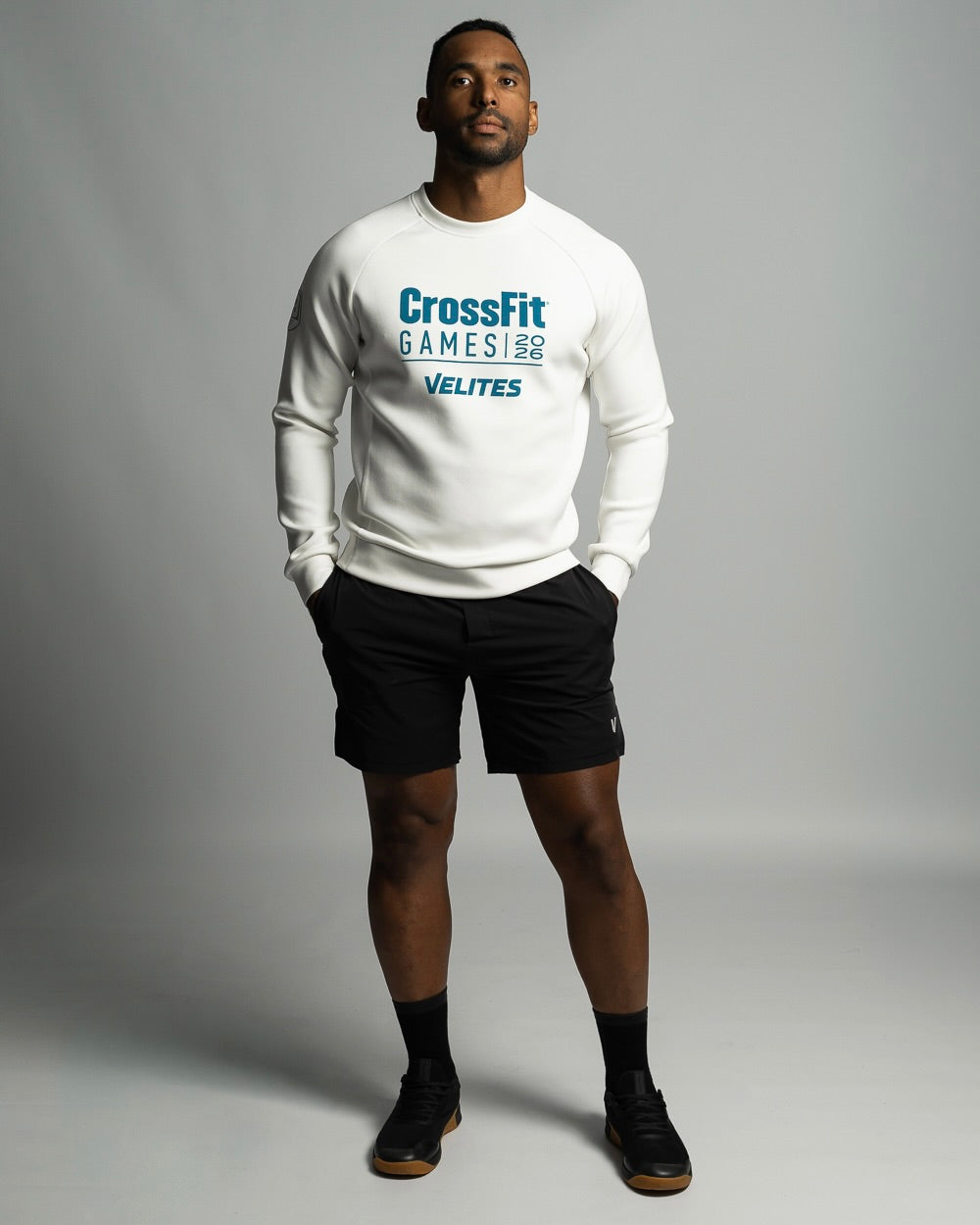 Studio lifestyle shot of the premium pearl white crewneck sweatshirt from the Velites capsule collection