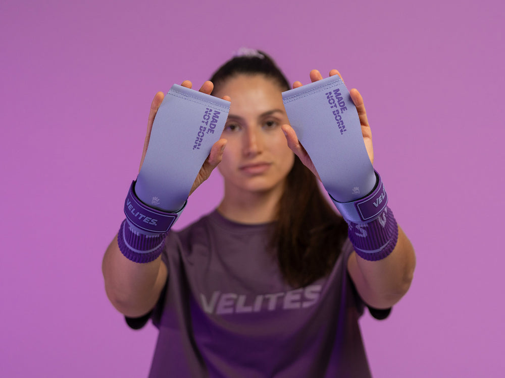 Athlete holding lilac grips